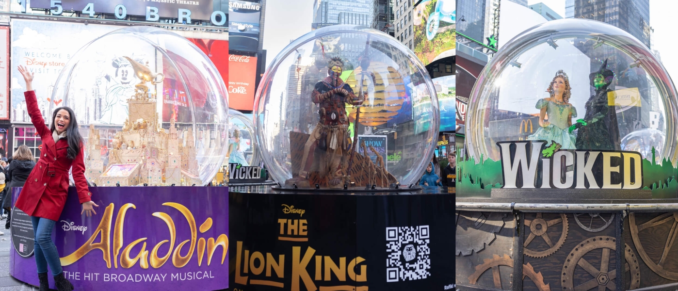Side-by-side photos of the Show Globes — giant snow globe-shaped structures taller than a person — for Aladdin, The Lion King, and Wicked