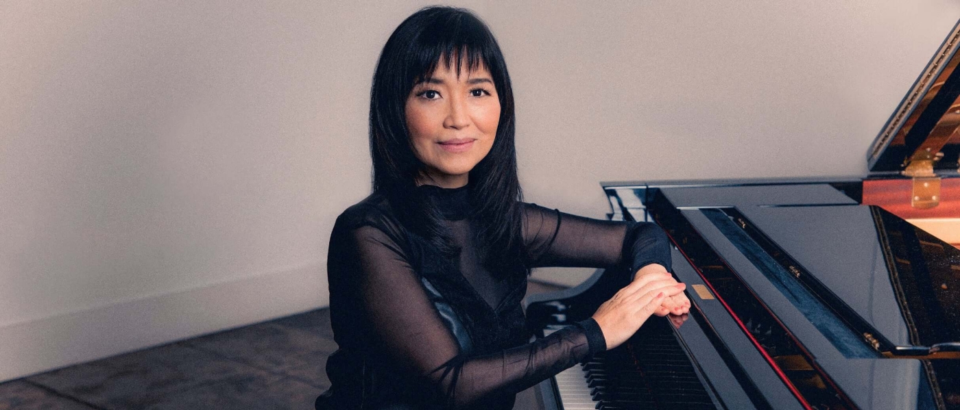 Keiko Matsui sitting at a piano