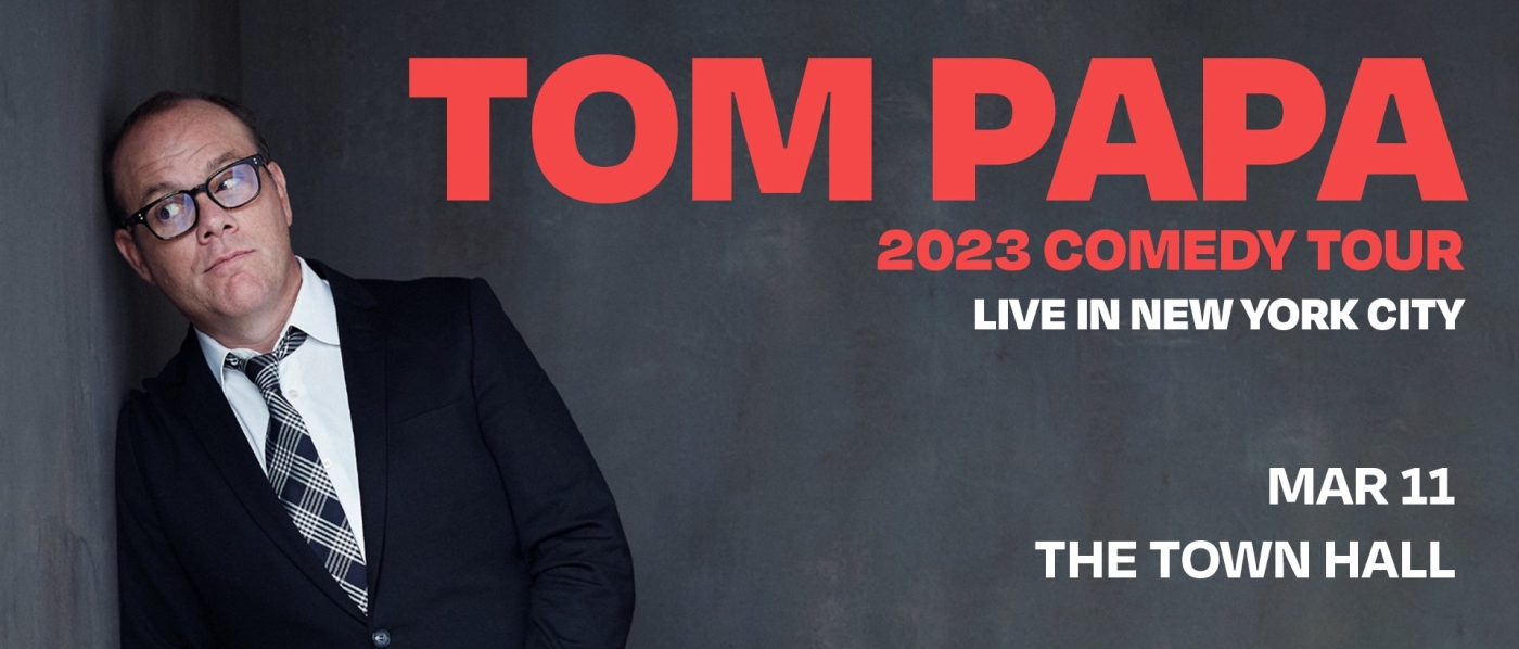 Tom Papa, an older white man in a suit, leaning against a wall, with text reading "Tom Papa 2023 Comedy Tour Live in New York City March 11 The Town Hall"