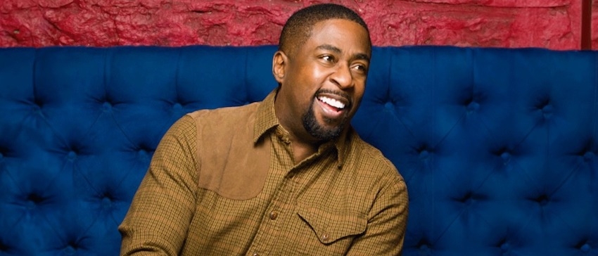Keith Robinson sitting on a couch