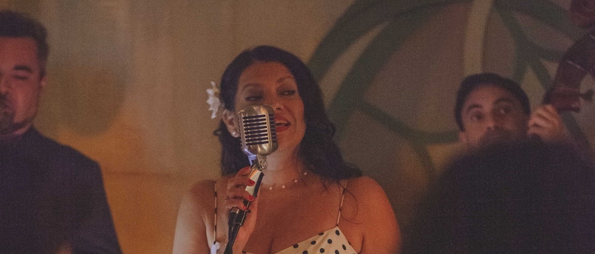 Mariella Price singing into a microphone
