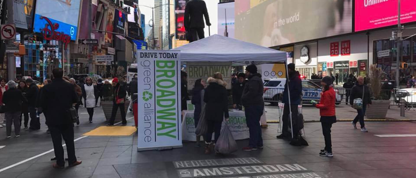 A Broadway Green Alliance tent on Duffy Square accepting textiles