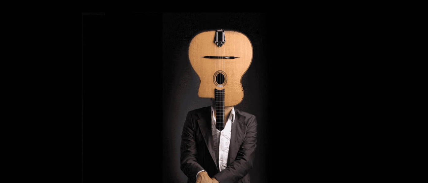 Edited photograph of a man in a suit where the upside down body of a guitar has replaced his head