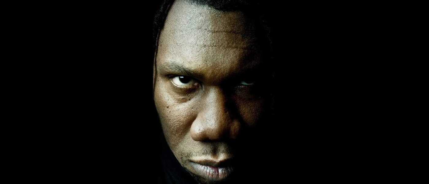 Close-up of KRS-Ones face against a dark background