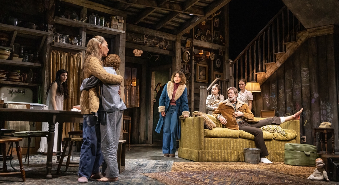 The company of Grey House on stage in a set resembling an old cabin. Photo credit Murphy Made.