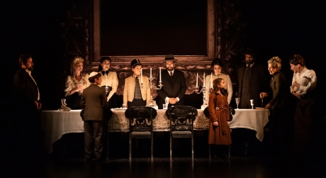 The Broadway Company of Leopoldstadt on stage around a dinner table with candles on it
