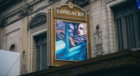 The Longacre Theatre exterior with a marquee for Lempicka, showing the artwork Self Portrait (Tamara in a Green Bugatti) by Tamara de Lempicka