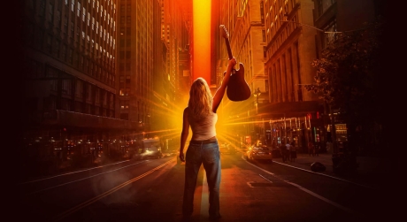 An illustration of Melissa Etheridge raising her guitar to the sky as the sun shines brightly above city buildings