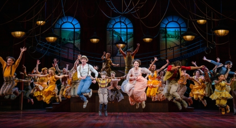Hugh Jackman, Sutton Foster, and the cast of The Music Man all mid-jump
